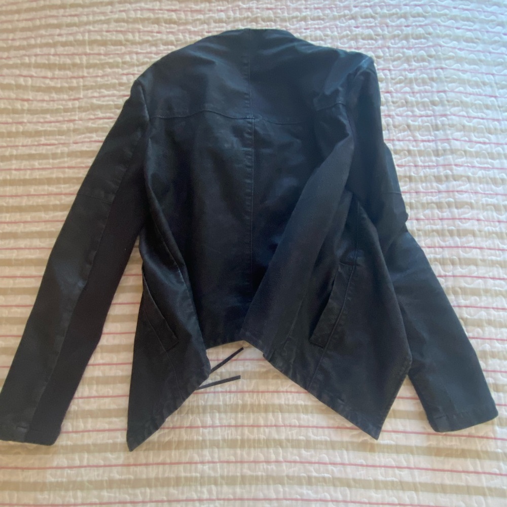 Black sueded waist high zip up or open flap jacket with zippered leather tassel